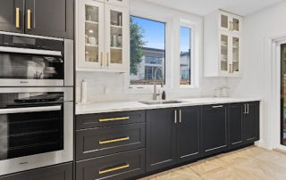 a balck and white kitchen- Cabinet Painting services near me